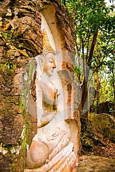 Carving Buddha art on rock in Huai Pha Kiang temple