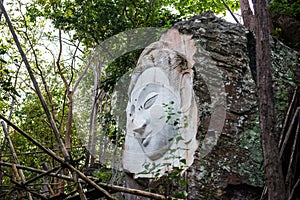 Carving Buddha art on rock in Huai Pha Kiang temple