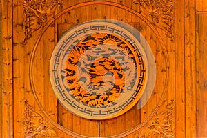 Carving of Chinese dragon and phenix  on a wooden door
