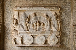 Carving details on the outer wall of Hazara Rama Temple. Hampi, Karnataka, India