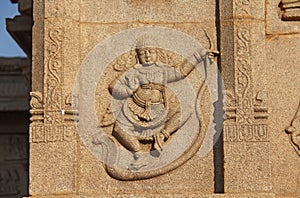 Carving details on the outer wall of Hazara Rama Temple. Hampi,