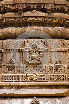 Carving details on the outer wall of Jhulta Minara, Ahmedabad, Gujarat photo