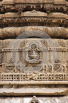 Carving details on the outer wall of Jhulta Minara, Ahmedabad, Gujarat, India photo