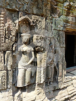 Carving of a devata on the walls of Ta Prohm