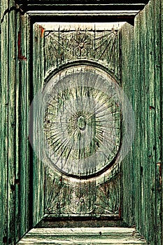 Carving on the front green door strikes