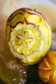 Carving with fruit-flower carved on mango for decoration