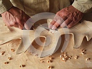 Carving a leaf in wood