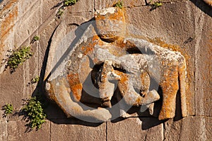 Carving of lion attacking a bull