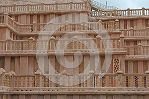 Carving on red stone railing