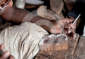 Carving a wooden printing block for textile block printing