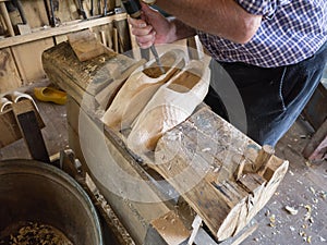 Carving of a wooden shoes