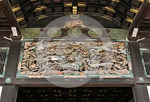 Carvings of exotic birds and floras beneath the entrance roof of Nijo Castle in Kyoto.