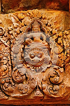 Carvings of gods over a door. Banteay Srei temple, Angkor, Cambodia.