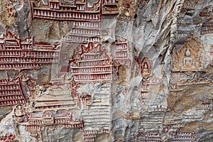 Carvings in Kaw Goon cave background in Myanmar.