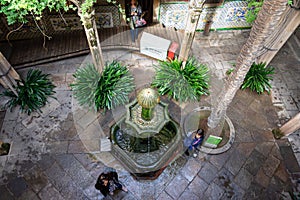 Casa de l`Ardiaca, courtyard shaded by trees and cooled by fountains. Barri Gotic. Barcelona