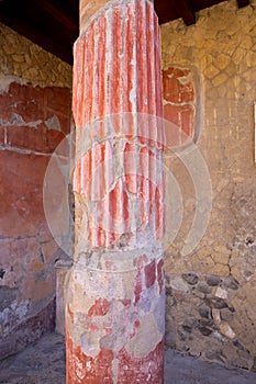 Casa della Gemma in Ercolano with columns. Ruins of ancient roman town Ercolano - Herculaneum, destroyed by eruption of Vesuvius