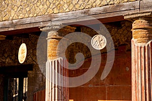 Casa della Gemma in Ercolano with columns. Ruins of ancient roman town Ercolano - Herculaneum, destroyed by eruption of Vesuvius