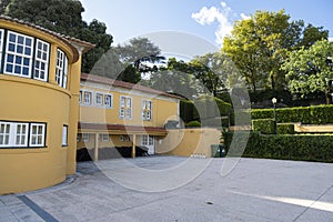 Casa do Roseiral Roseiral House. Yellow house in the middle of a garden. Jardins do PalÃ¡cio de Cristal Cristal palace gardens