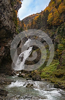 Cascada Del Estrecho  Estrecho waterfall in Ordesa valley, in Autumn season, Heusca, Spain photo