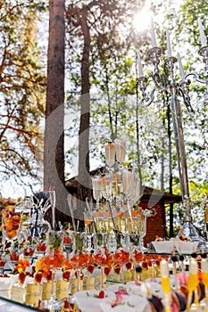 Cascade of champagne glasses. Pyramid of glasses for champagne or drinks. Vacation at the party