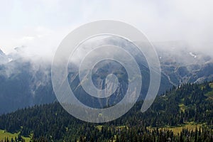 Cascade Mountain ranges in foggy morning with sun peeks