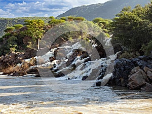 cascade of Ruacana Falls lies on the border of Namibia and Botswana