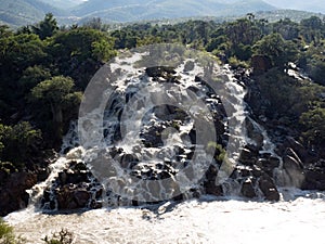 cascade of Ruacana Falls lies on the border of Namibia and Botswana