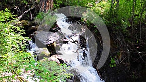 A cascade of small waterfalls on the river Boci, flowing from the mountains.