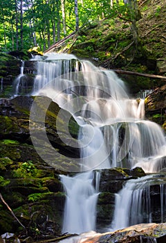 Cascades of big waterfall in forest