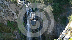 Cascades On Sheer Rock Mountain At Fervenza do Toxa. Aerial Pullback