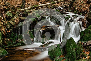 Cascades of small river stream in Orlicke Mountains,Czech republic. Long exposure water.Fresh spring mountain scenery.Untouched