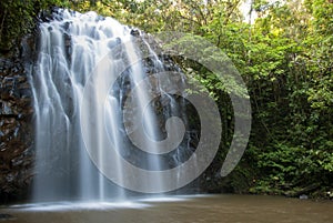 Cascades of water flowing over rock in jungle