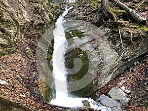 Cascades and waterfalls on the creek under the Alp Sigel peak in Alpstein mountain range and Appenzellerland region