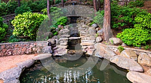 Cascading fountain with a stones in landscape design