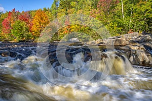 Cascading River and Colorful Autumn Leaves