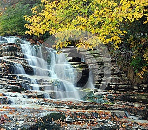 Cascading Waterfall In Autumn