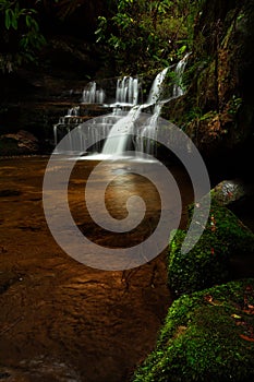 Cascading waterfall in lush bush land Australia