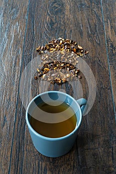 Cascara or Coffee Cherry Tea in Cup. Sun-Dried Peeled Coffee Beans photo