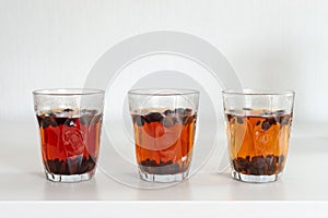 Cascara tea in glass on white table background, photo