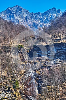 Cascata di Val Mott waterfall and Cima di Bri mount, Valle Verzasca, Switzerland photo