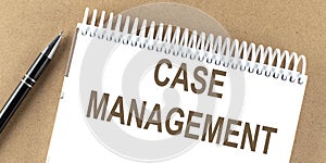 CASE MANAGEMENT text on a notepad with pen, business concept