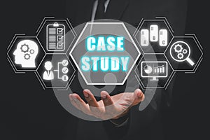 Businessman hand holding case study icon on virtual screen
