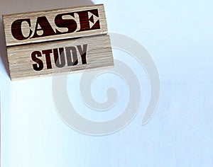 Case study words on wooden blocks, wallet, pill of coins. Business concept