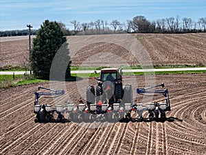 Case 7240 tractor pulling a .Kinze 3205 12 row planter planting corn