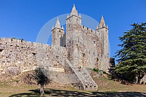 Casemate bunker emerging from the walls and the keep of Castelo da Feira Castle photo