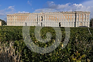 Caserta, Italy. 27/10/2018. The external facade of the palace of Caserta. In the foreground the boxwood plants of the apio garden