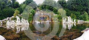 CASERTA, NAPLES, ITALY - OCTOBER 17, 2015. Caserta Royal Palace, statues and reflections in the gardens