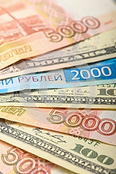 Cash banknotes background. The background of the American and Russian money banknotes. Dollars and rubles background