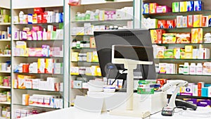 Cash desk - computer and monitor in a pharmacy. Interior of drug and vitamins shop. Medicines and vitamins for health and healthy