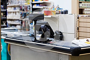 Cash desk with terminal in supermarket